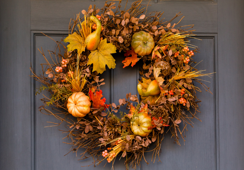 fall wreath hanging on a front door